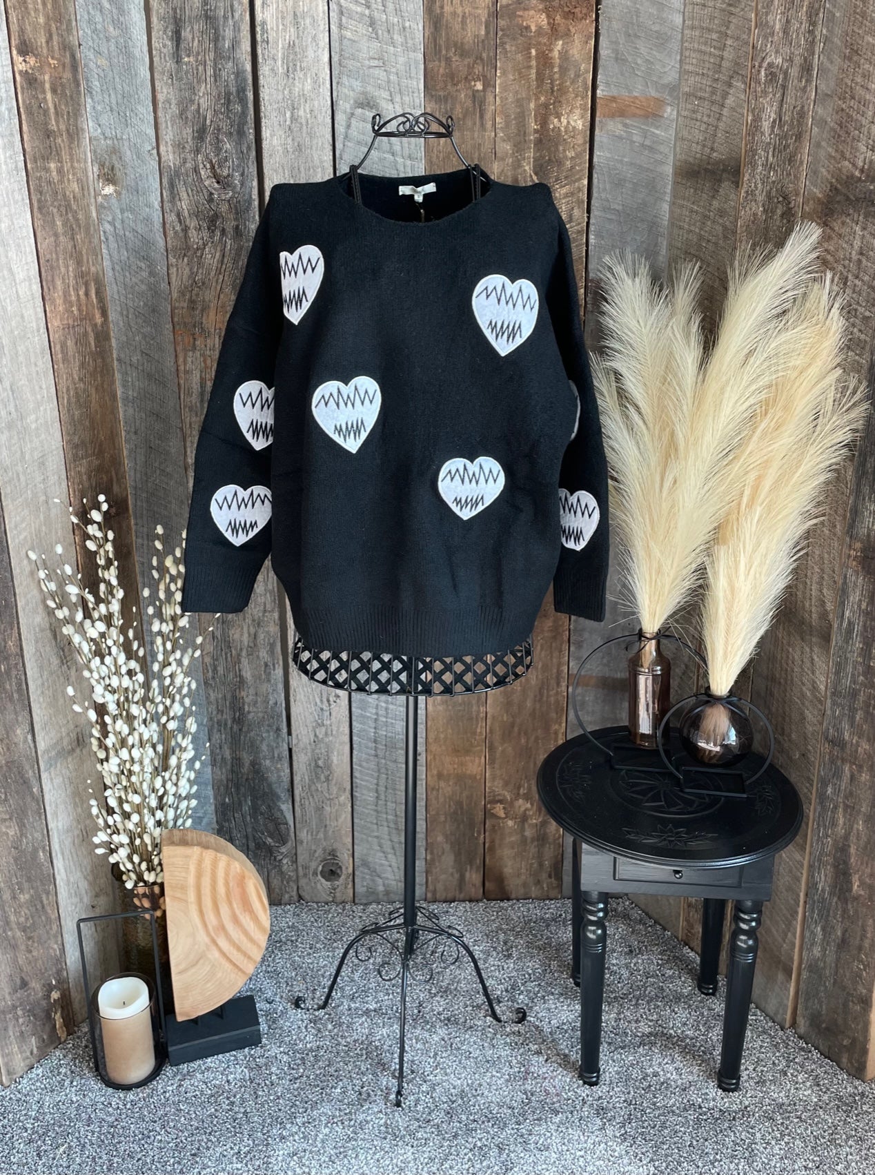 Black sweater with heart patches