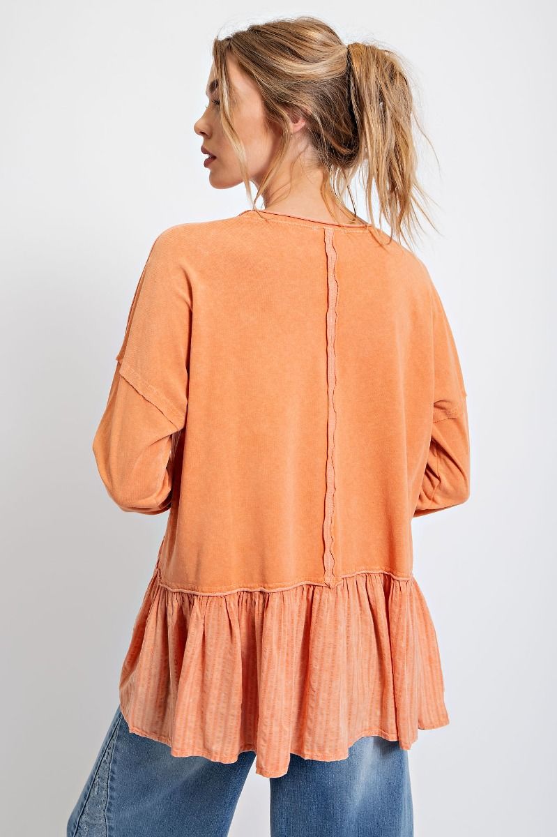 Faded orange peplum top