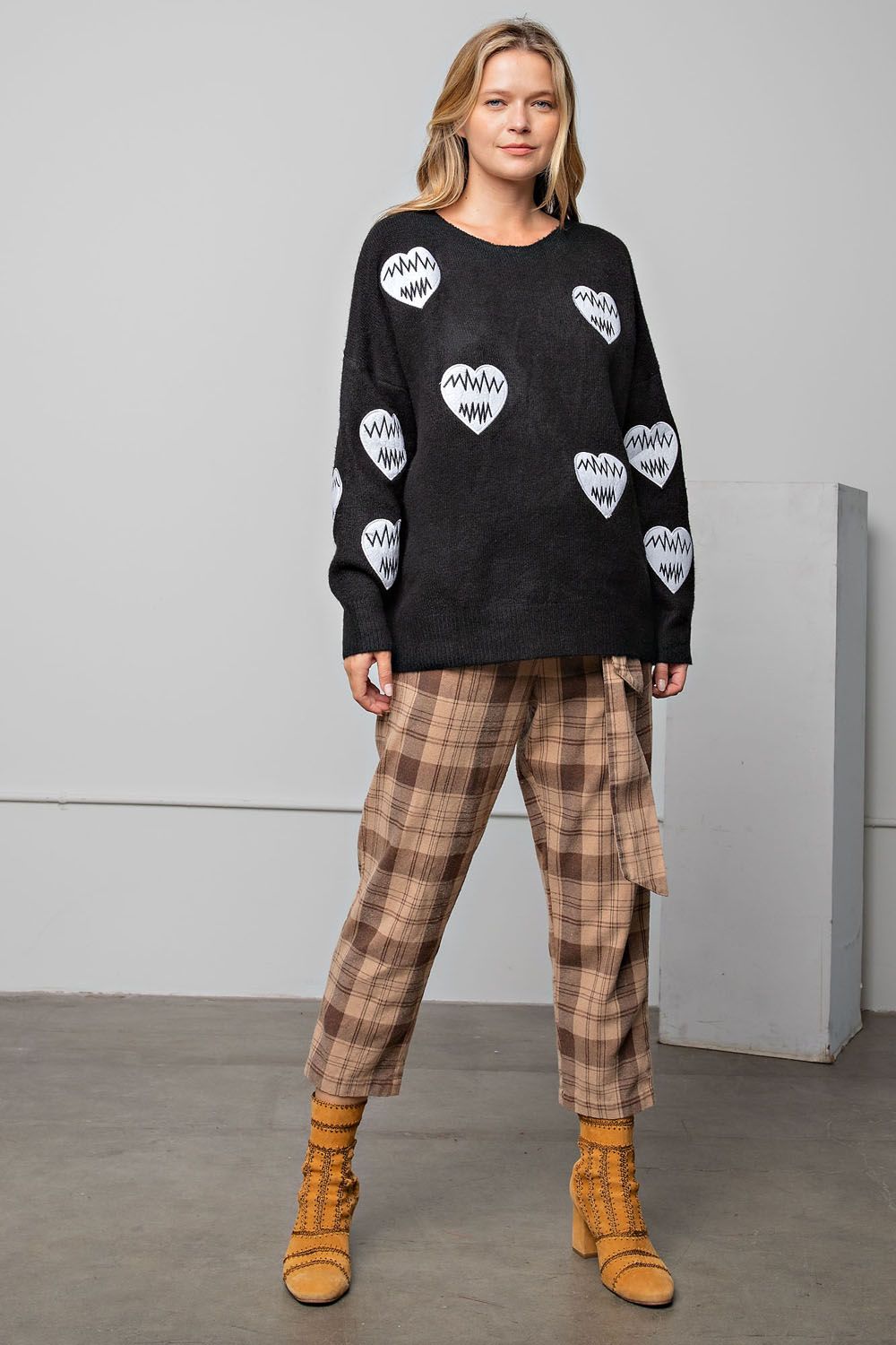 Black sweater with heart patches