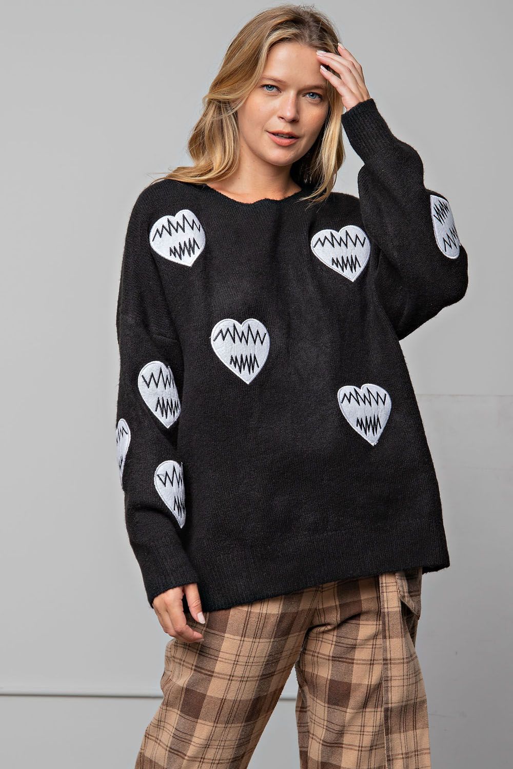 Black sweater with heart patches