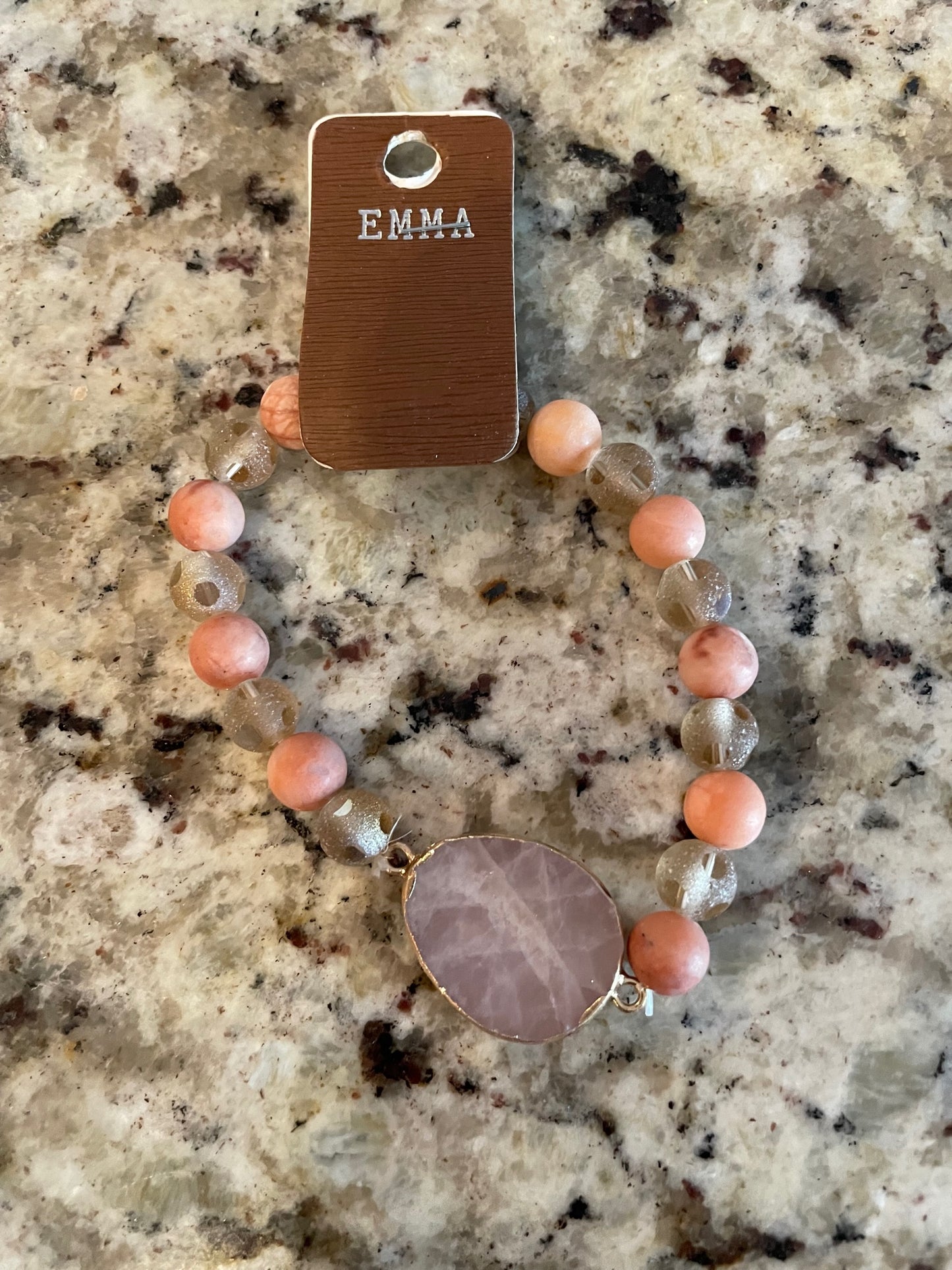 Pink stone bracelet with large center stone