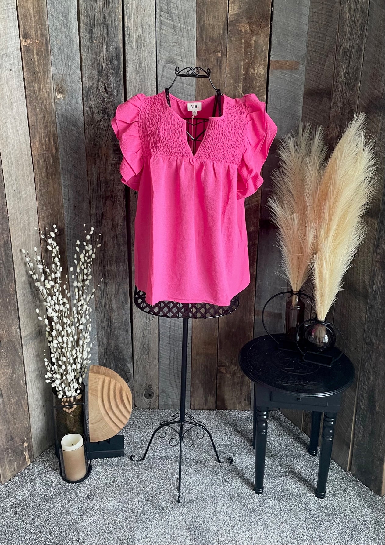 Fuchsia smocked top with ruffled sleeves