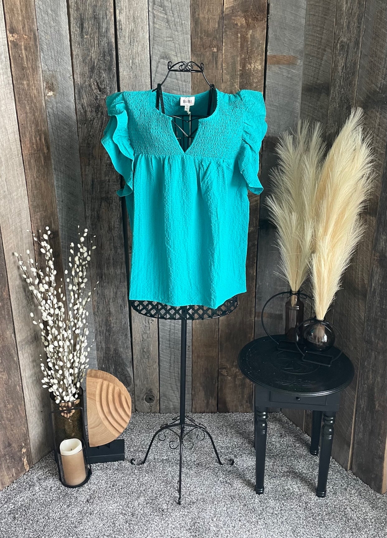 Jade smocked top with ruffled sleeves