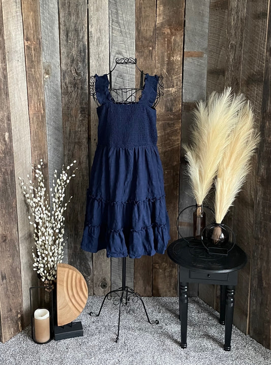 Navy smocked tiered dress with ruffled straps