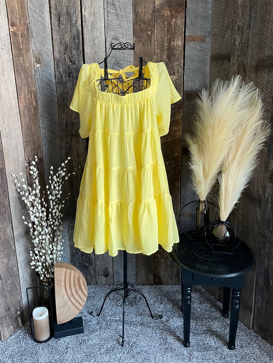 Yellow tiered dress with bow back detail