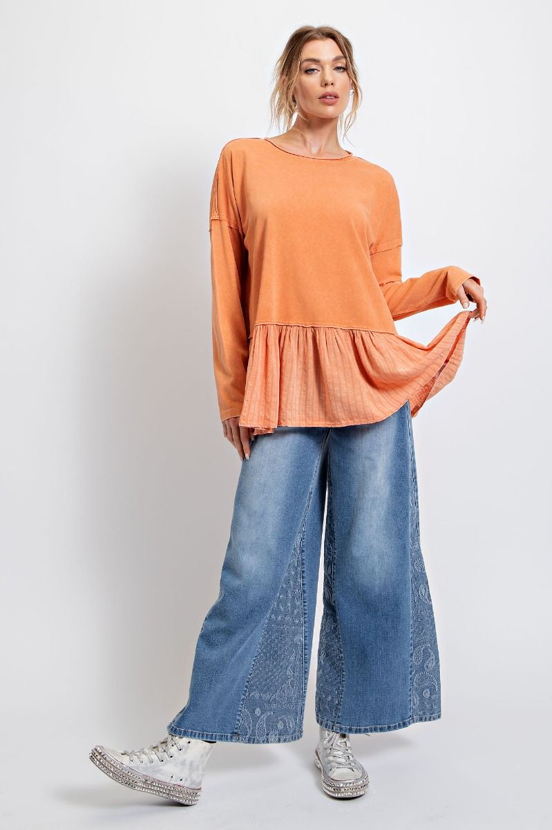 Faded orange peplum top